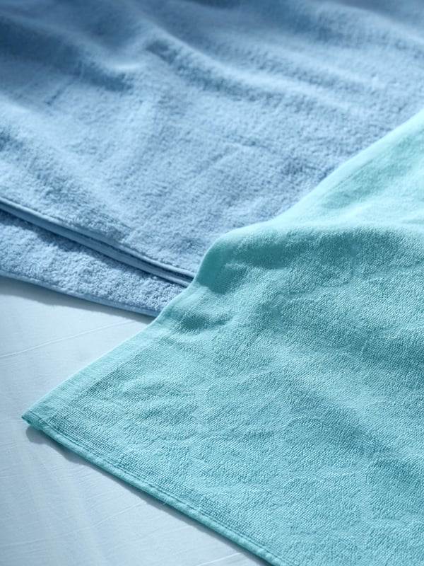 A light blue PANTERRANKA quilt