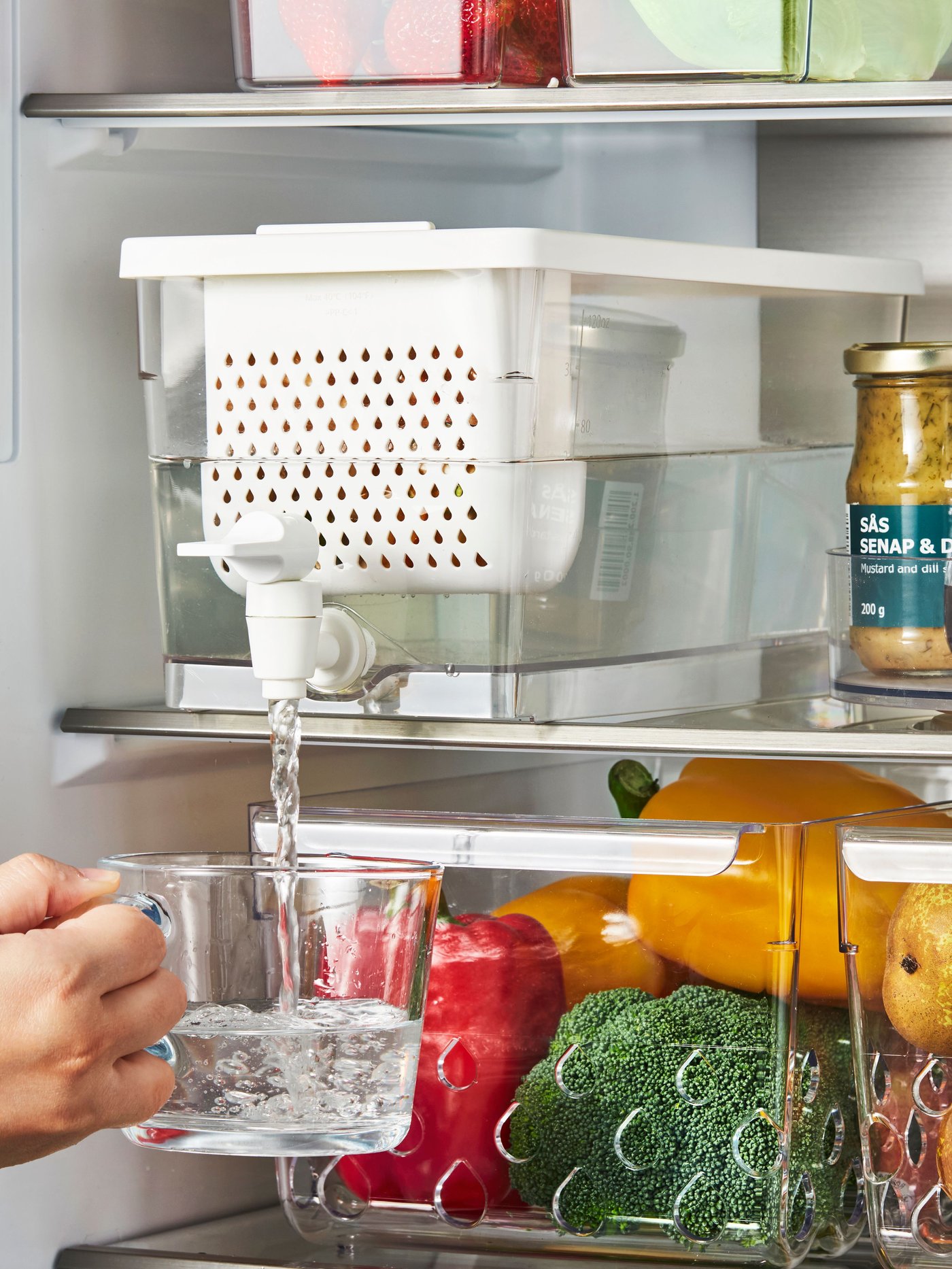 A transparent KLIPPKAKTUS container w tap disp for fridge