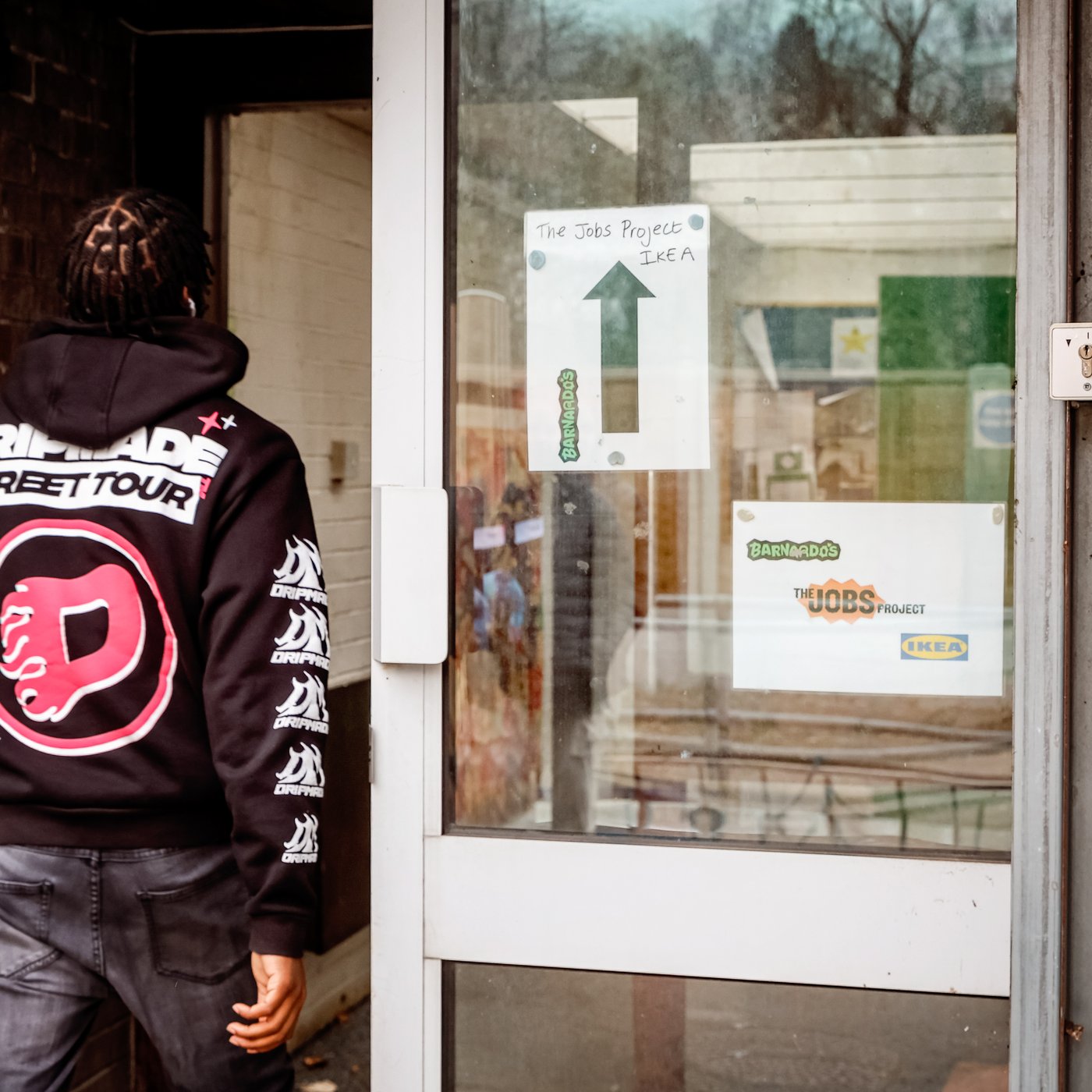 A person entering a door.