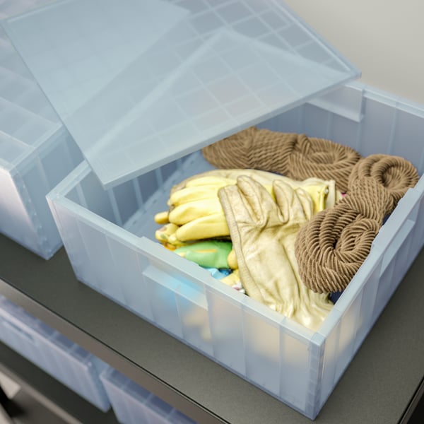 A transparent grey-blue PANSARTAX storage box with lid