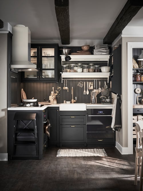 Kitchen with a base cabinet with hob and oven, a base cabinet for sink, a wall mounted extractor hood, and a wall cabinet.