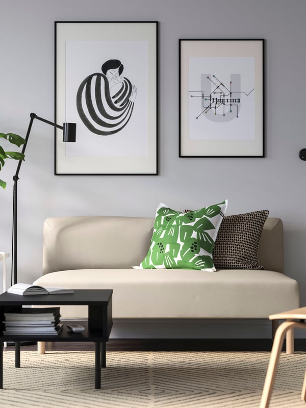 A white/green UNDERBLOMMA cushion cover
