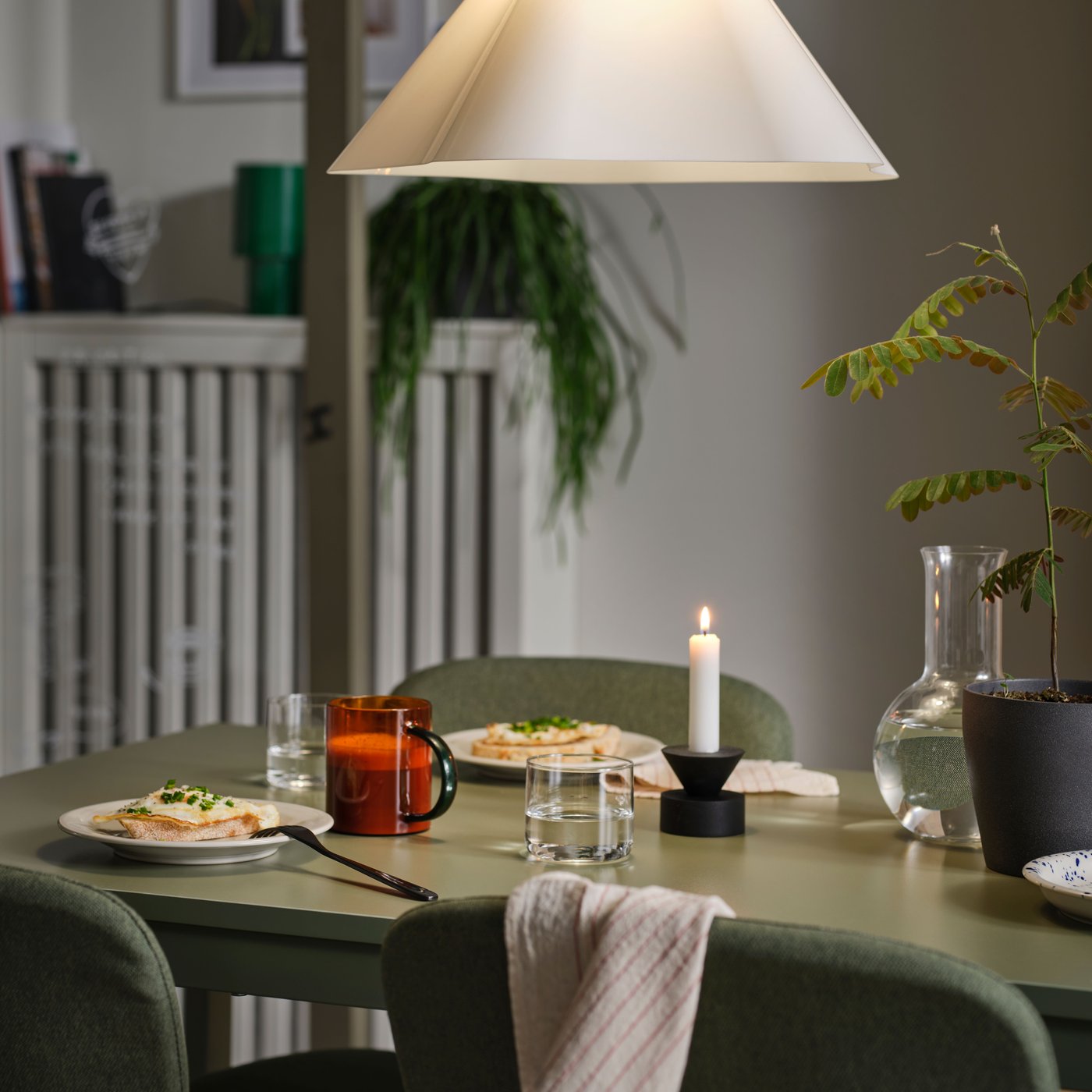 A white/plastic ZEBRASÄV pendant lamp in the dining room