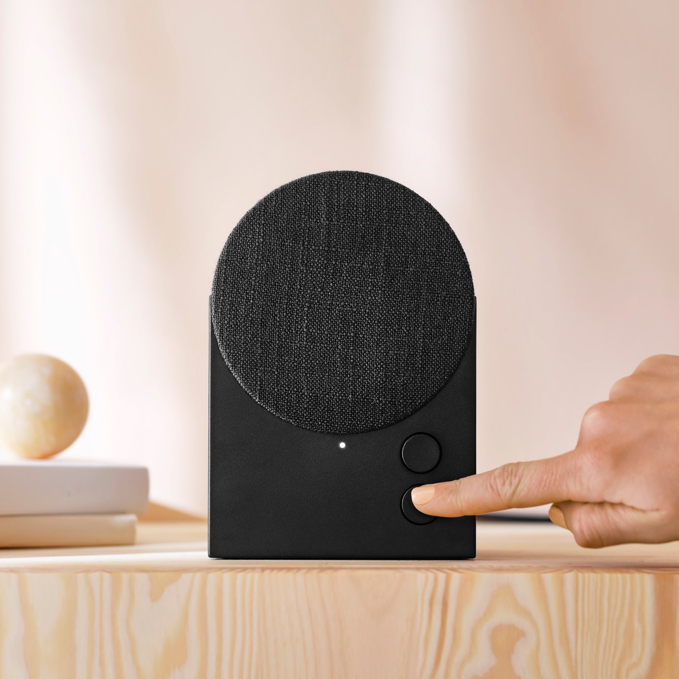 A black NATTBAD Bluetooth speaker in the NA