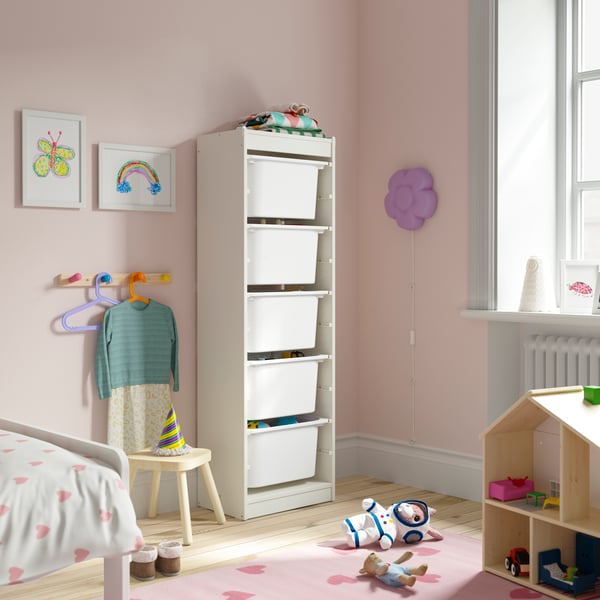A white/white TROFAST storage combination with boxes in the childrens room