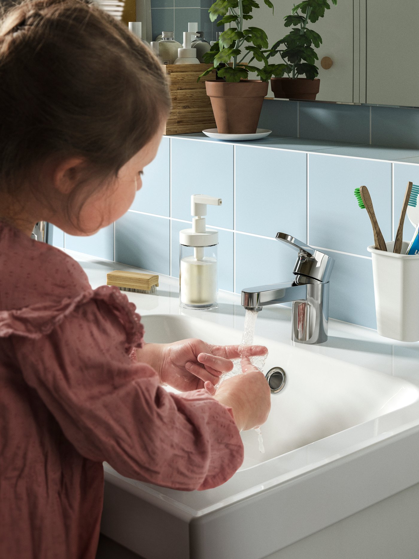 A chrome-plated ENSEN wash-basin mixer tap in the bathroom