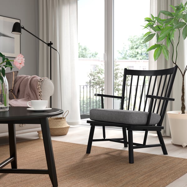 A black/Tibbleby beige/grey PERSBOL armchair