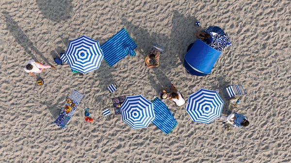 A blue STRANDÖN folding table set outside
