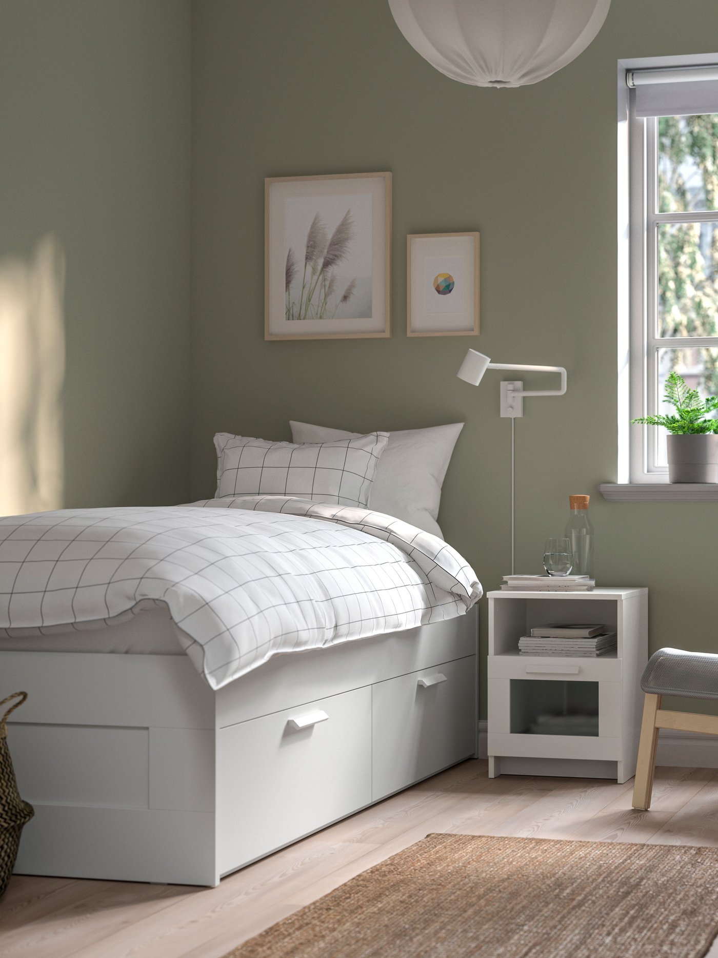A white/Luröy BRIMNES bed frame with storage in the bedroom