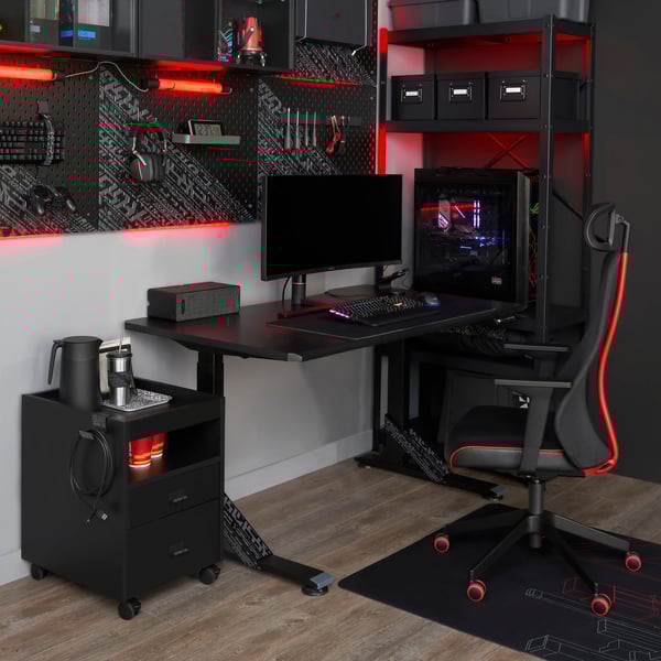 A black UPPSPEL desk, chair and drawer unit