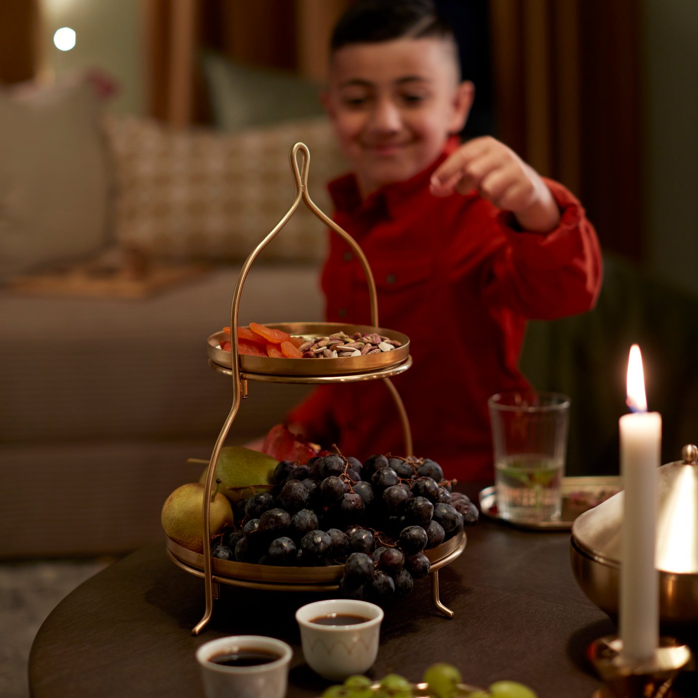 A white JUBLA unscented chandelier candle