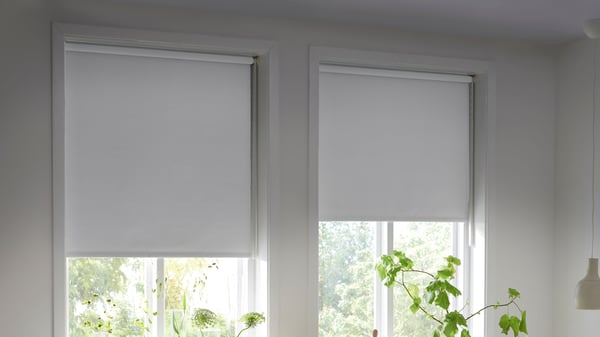 A white FRIDANS block-out roller blind