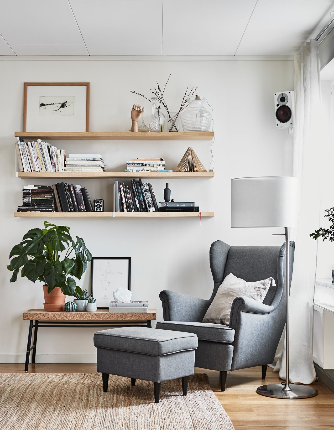 A Nordvalla dark grey STRANDMON wing chair in the living room
