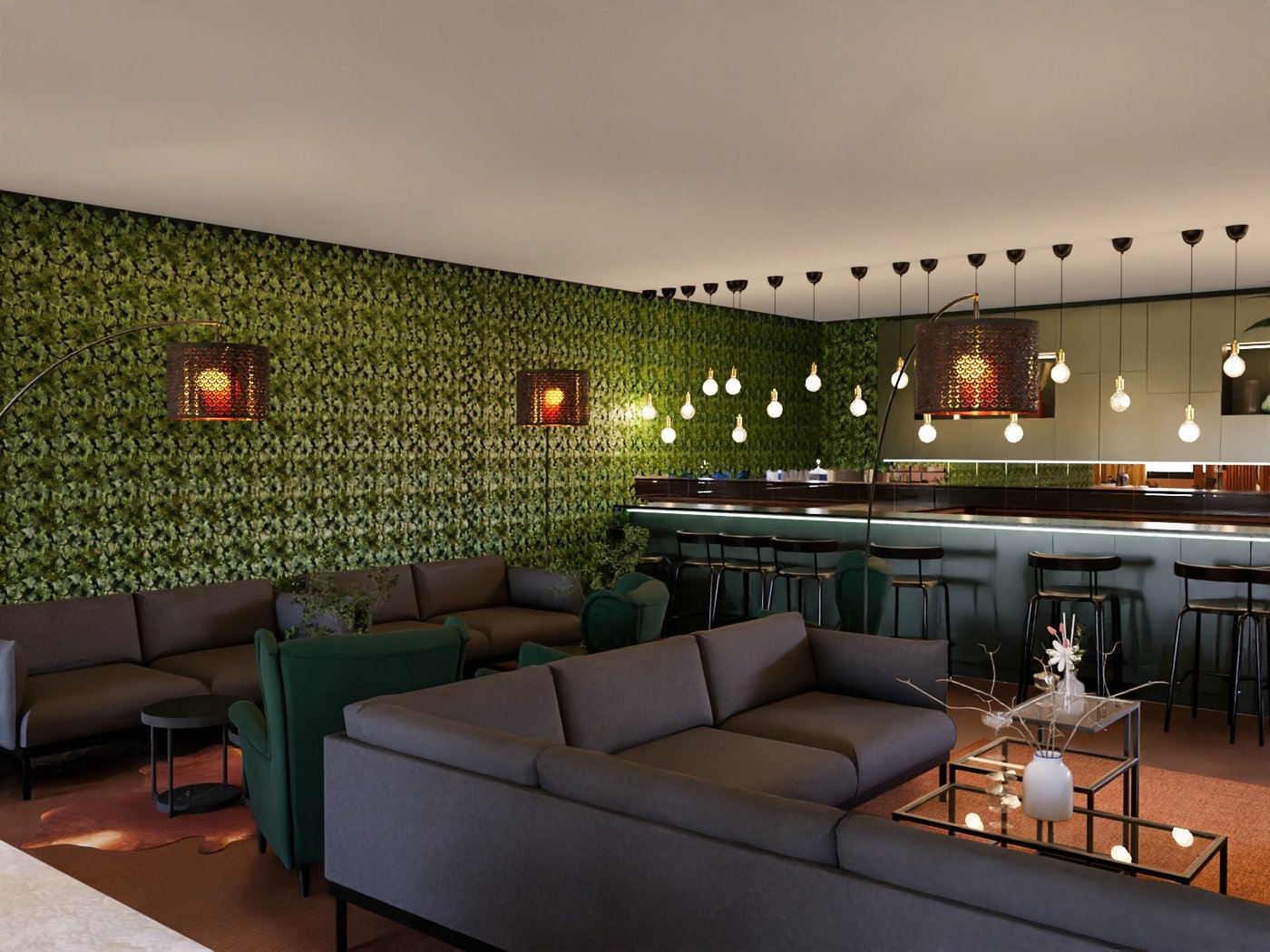 Teil eines Hotelrestaurants. Im Vordergrund ein loungebereich mit Sofas, Couchtischen und weiteren Stizmöbeln. Im Hintergrund die Bar mit Barhockern und Beleuchtung