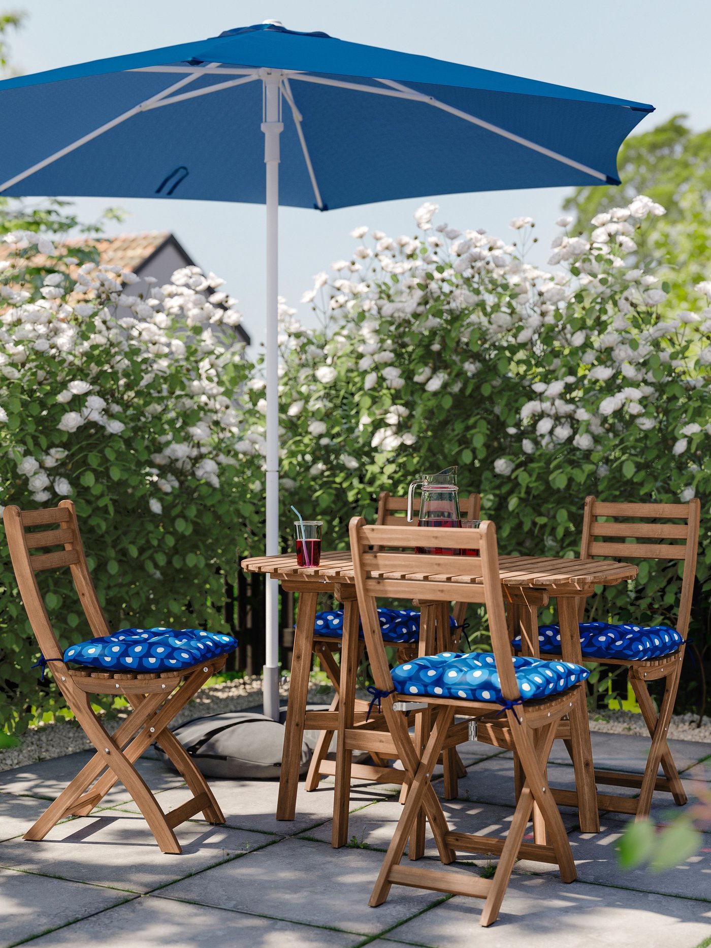 A dark brown ASKHOLMEN gateleg table, outdoor outside