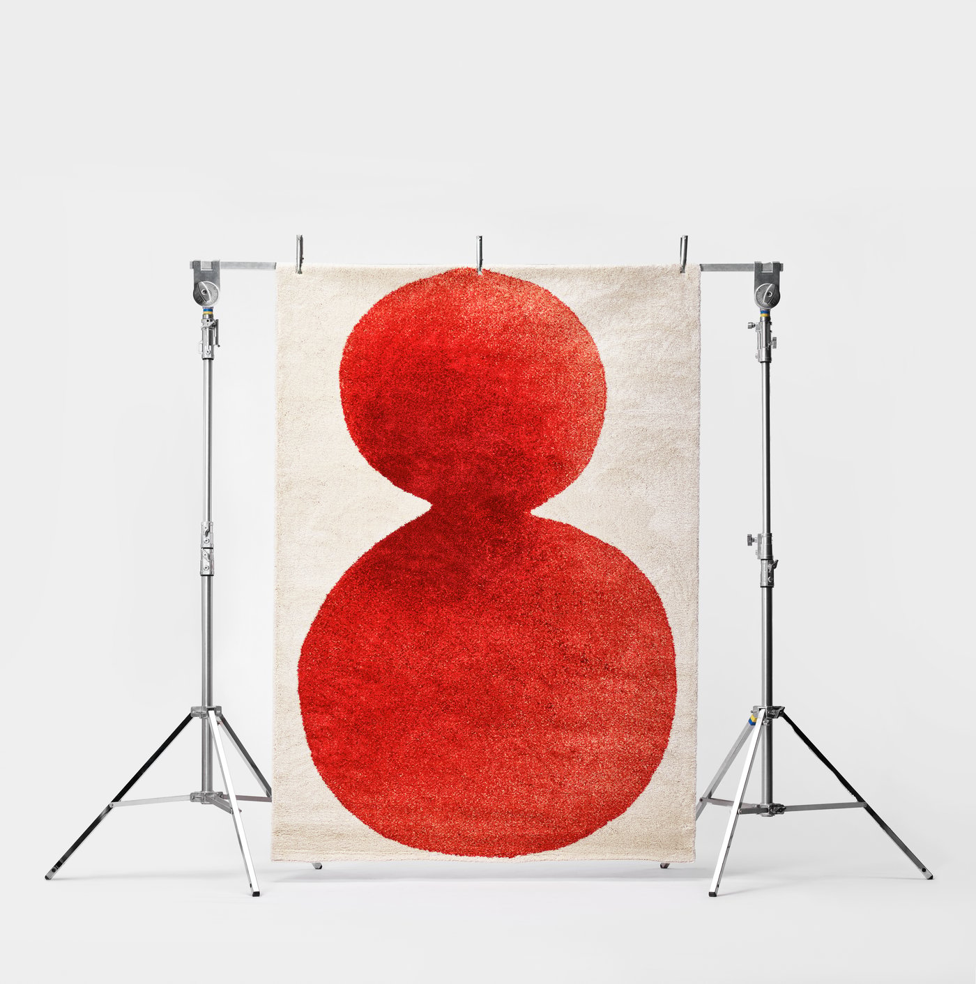 An off-white/red IKEA PS 2026 rug, low pile