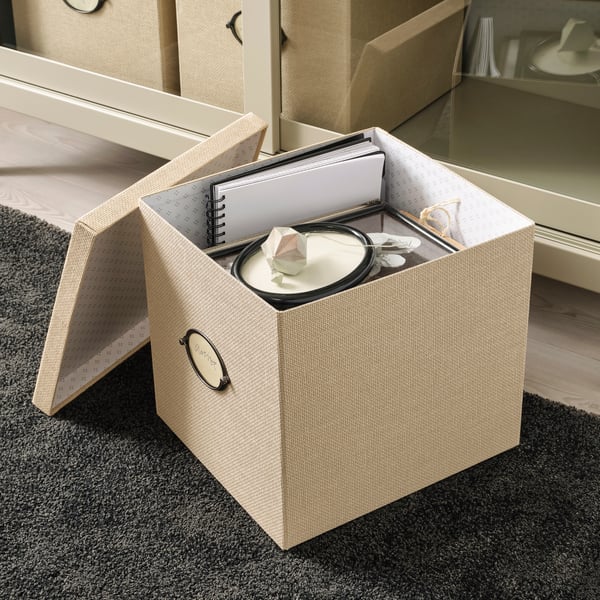 A beige KVARNVIK storage box with lid