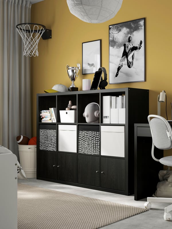 A black-brown KALLAX shelving unit with 4 inserts