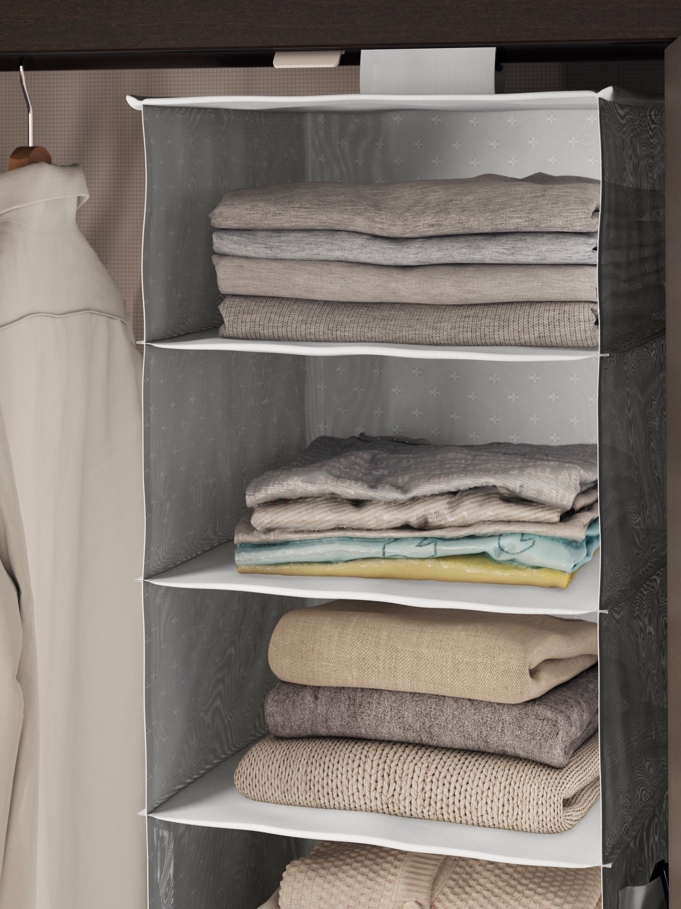 A grey/patterned BLÄDDRARE hanging storage with 7 compartments