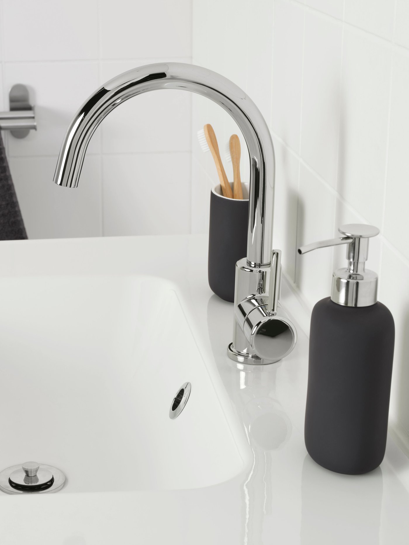 A chrome-plated GLYPEN wash-basin mixer tap