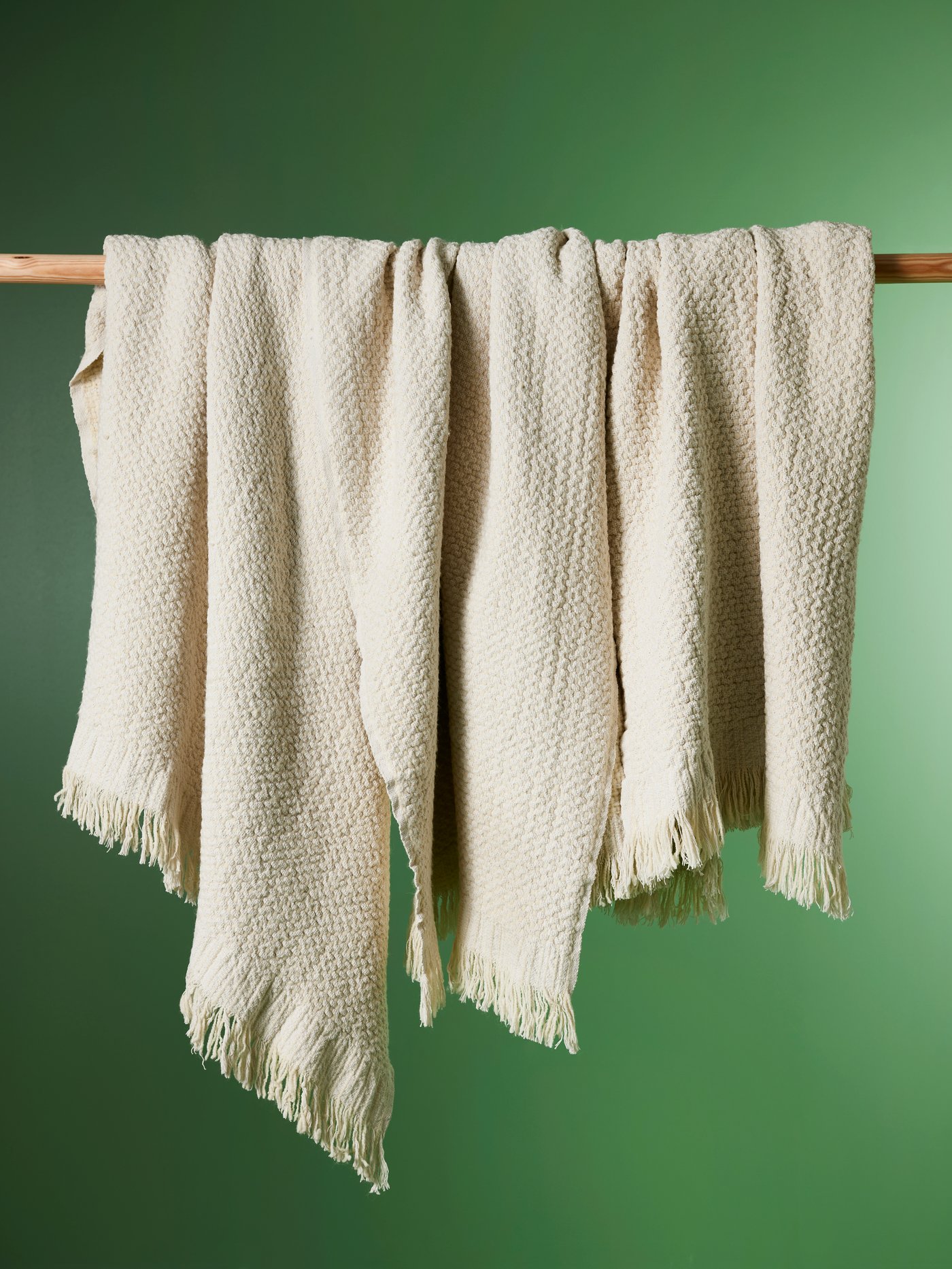 An off-white LAPPTÅG throw