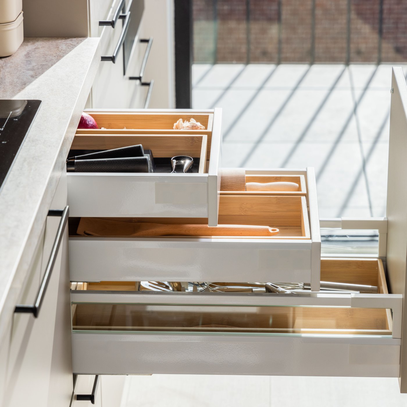 Beige HAVSTORP drawers, which are open.