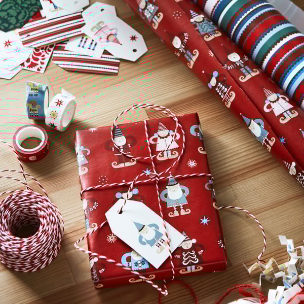 Papel de regalo VINTERFINT rojo con dibujos del viejo apscuero
