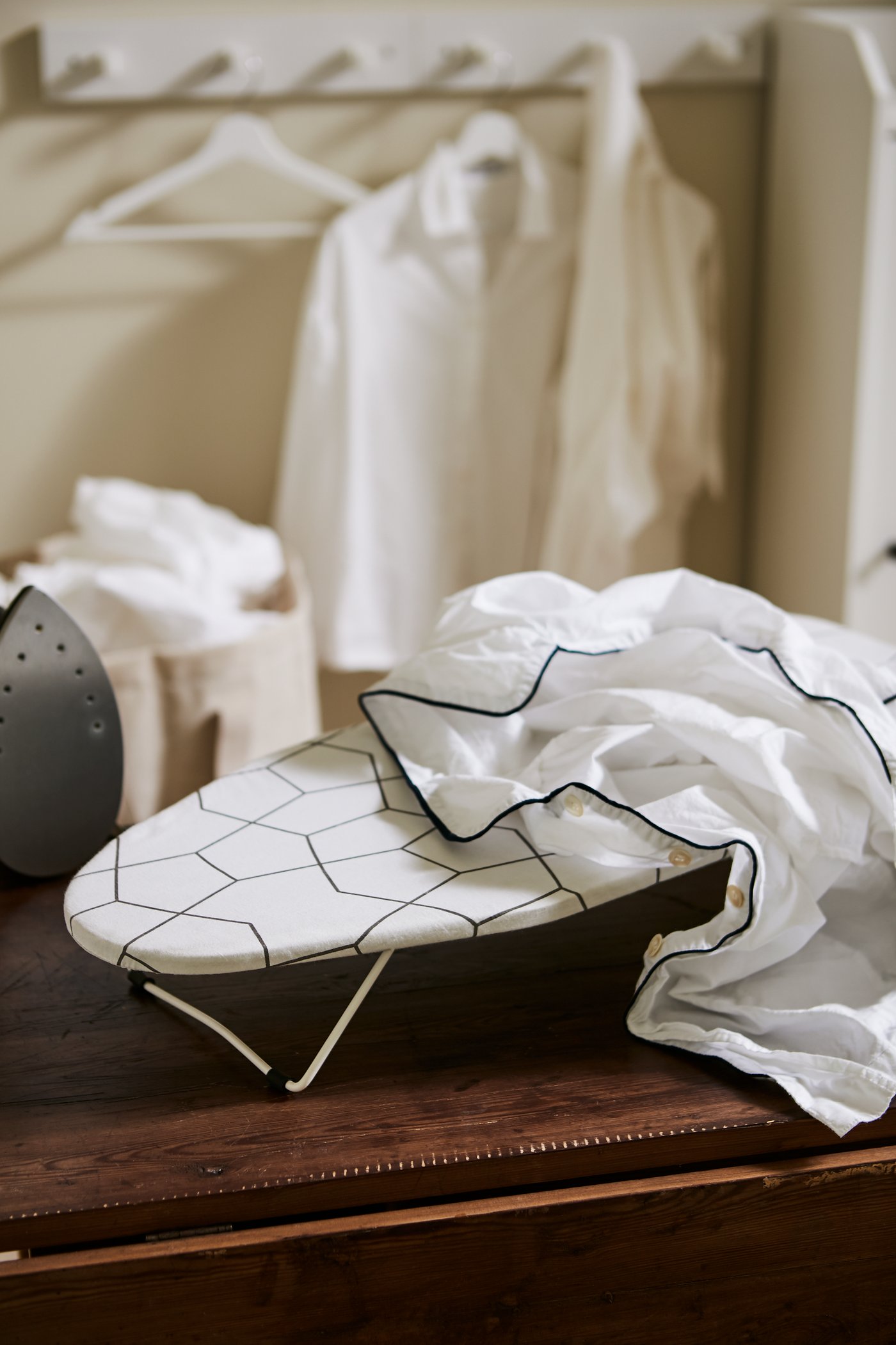 A white BUMERANG hanger in the laundry room