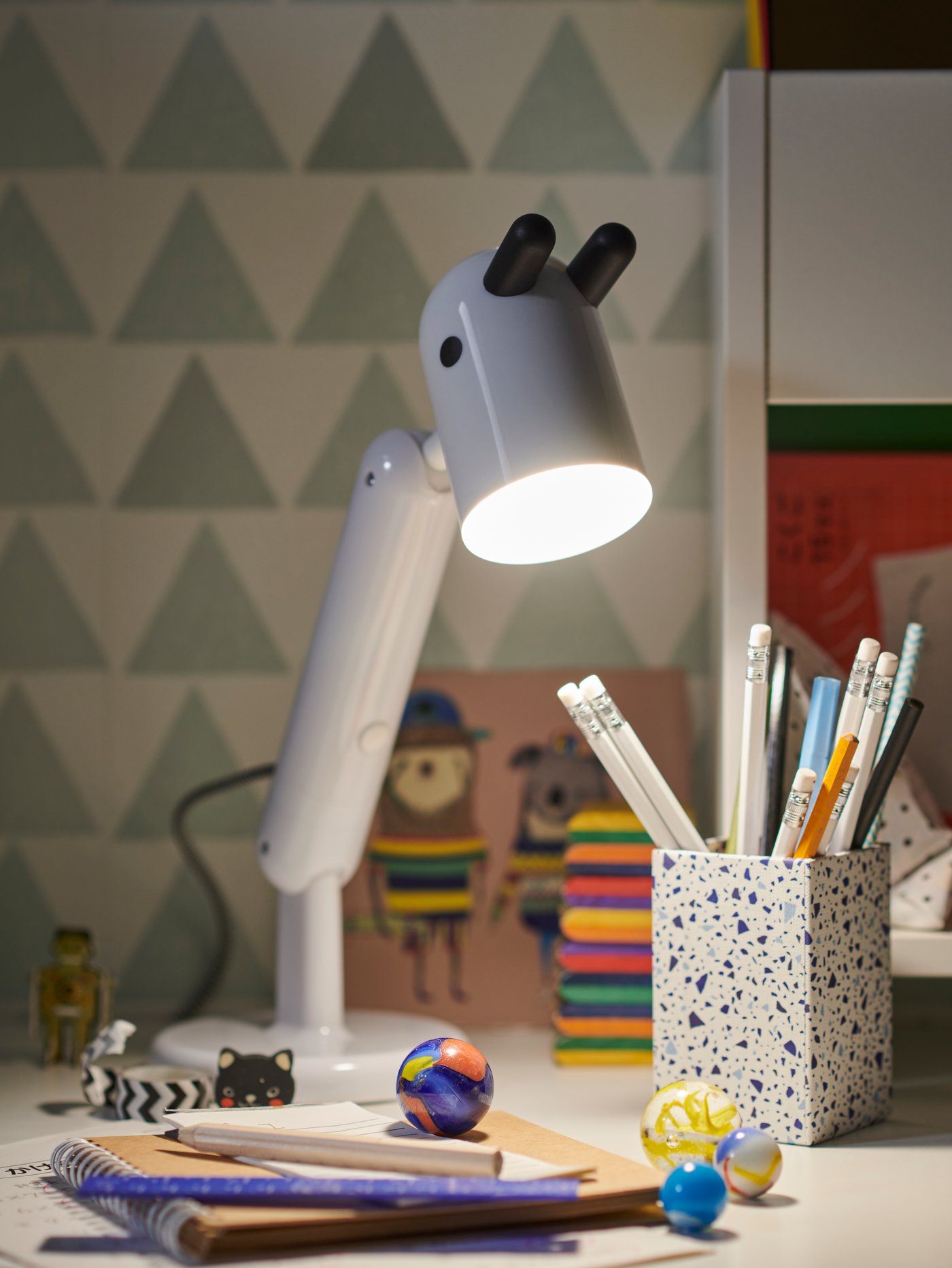 A white KRUX LED work lamp in the childrens room
