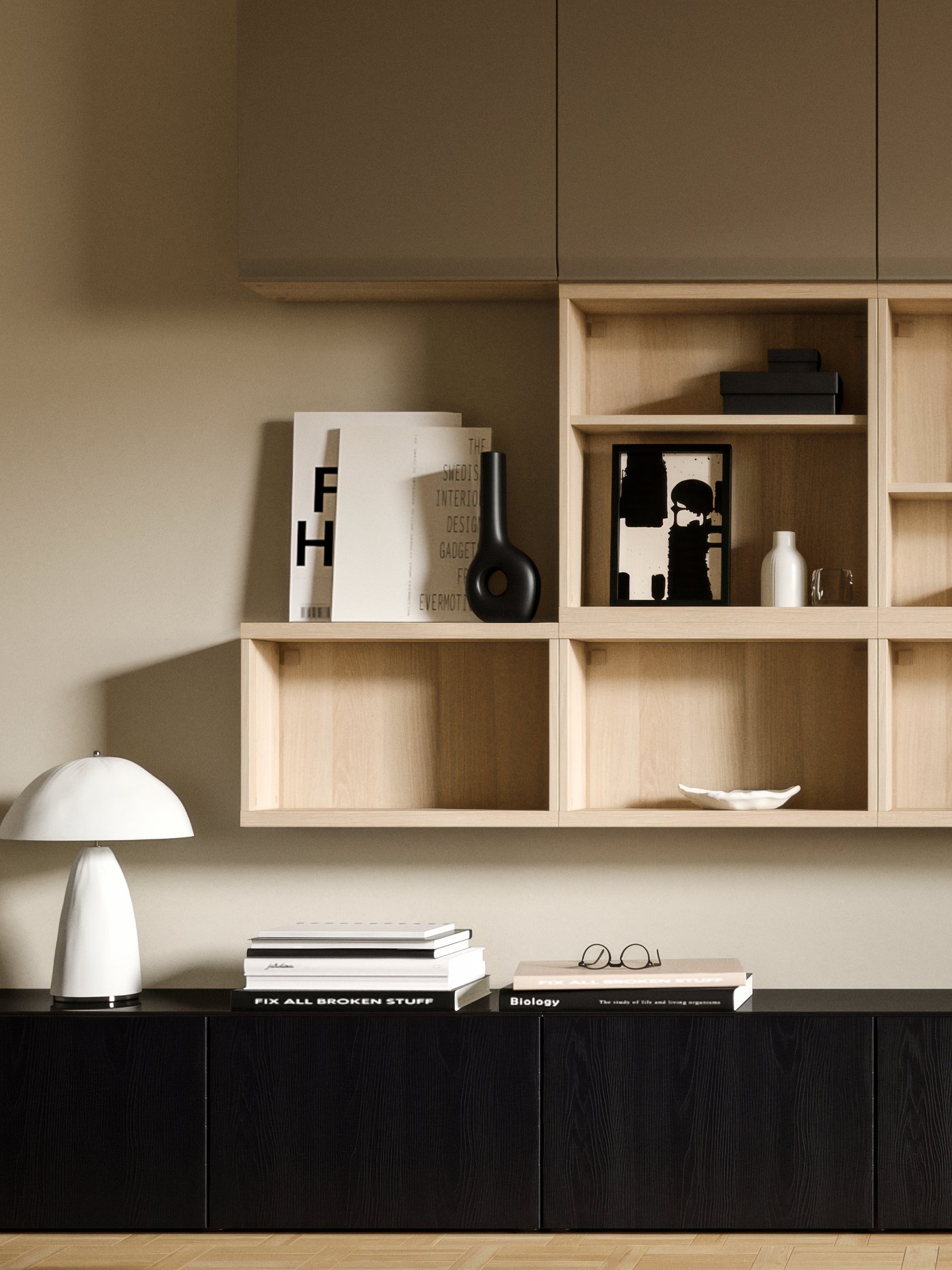 A living room wall with a variety of BESTÅ storage, including BESTÅ TV benches with doors on the floor.