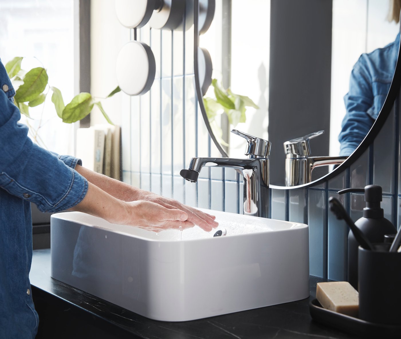 An ÅBÄCKEN mist nozzle for mixer tap in the bathroom