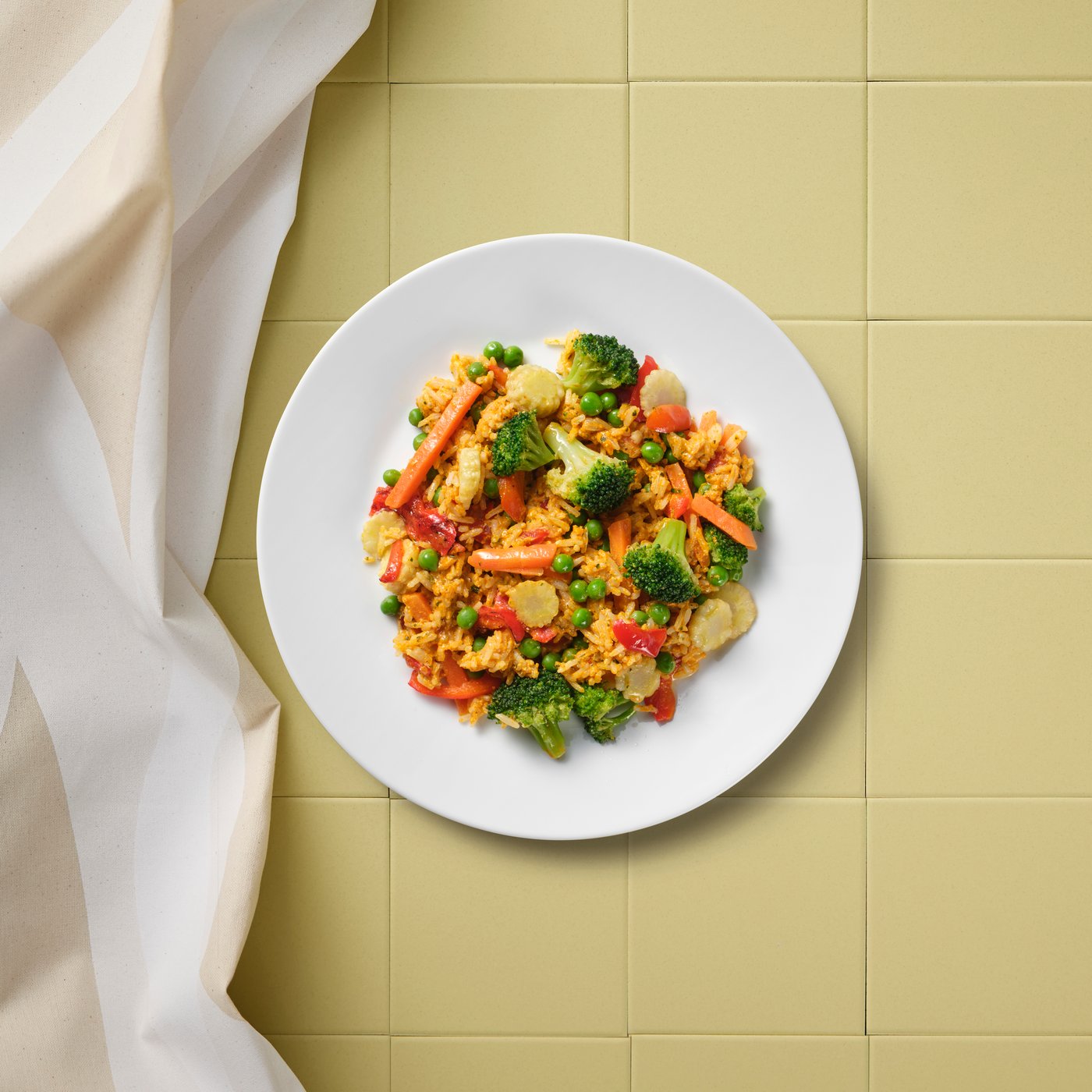 A patterned/white light beige KRUSTISTEL tablecloth