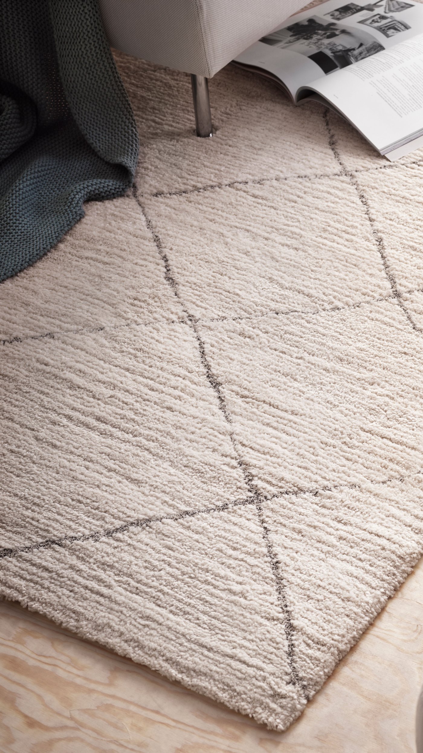 A beige TVERSTED rug, low pile