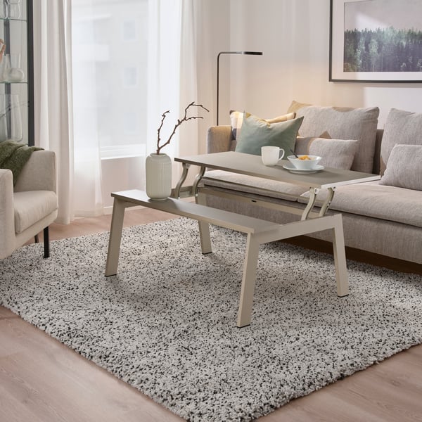 An adjustable beige LJUNGSBRO coffee table