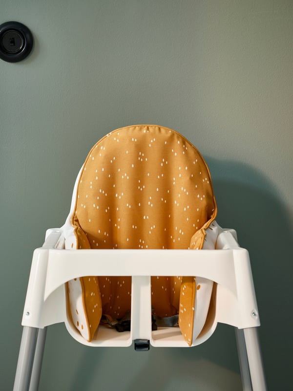 A dark yellow/white dotted ANTILOP supporting cushion and cover