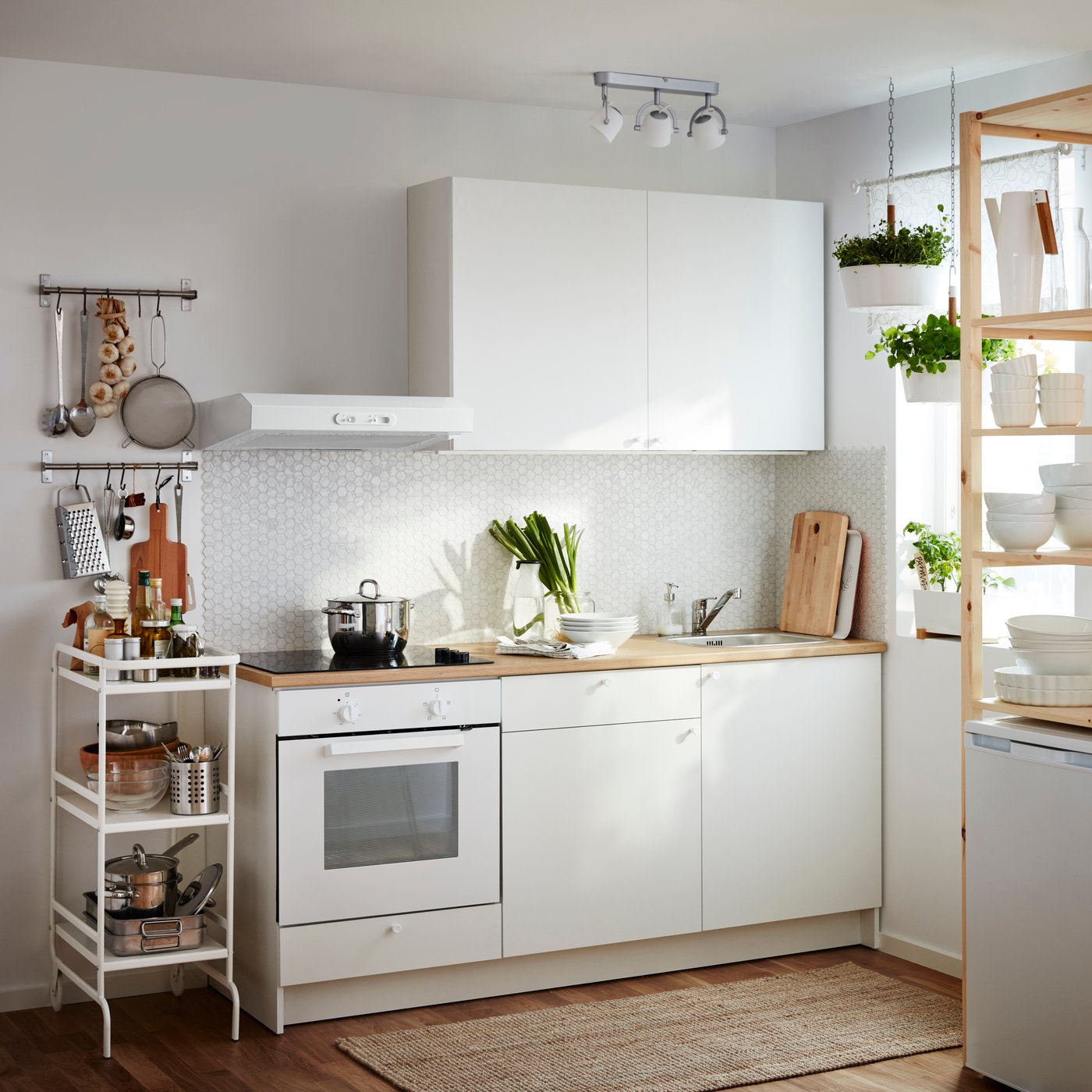 A white BITTERGURKA hanging planter in the kitchen