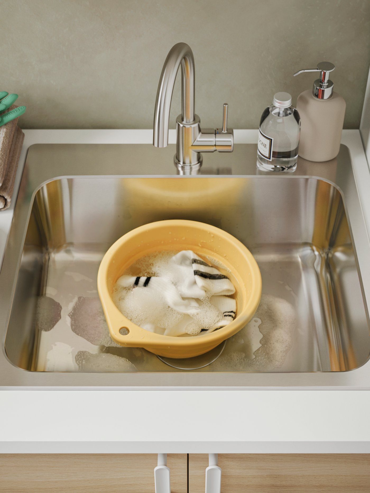 A foldable/yellow PEPPRIG wash-tub