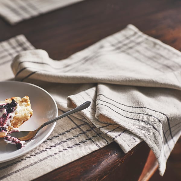 A dark grey/natural VÅRARV place mat