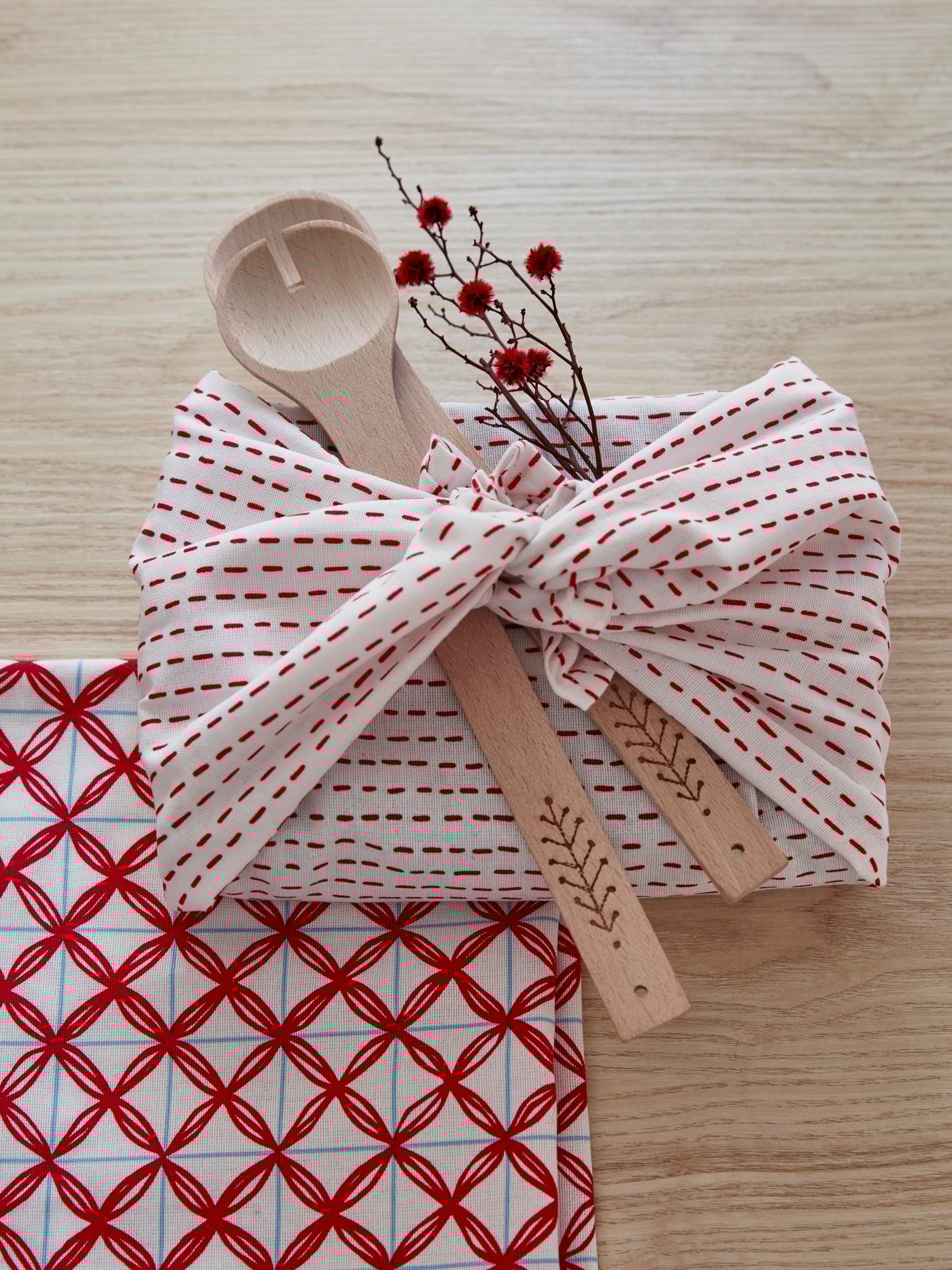 A patterned white/red VINTERFEST tea towel in the kitchen