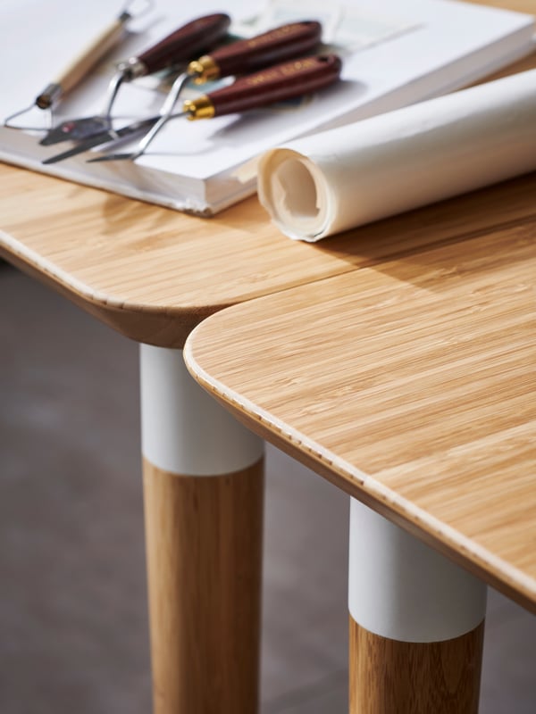 A FJÄLLBERGET office chair with castors on a plastic floor protector in a home studio.