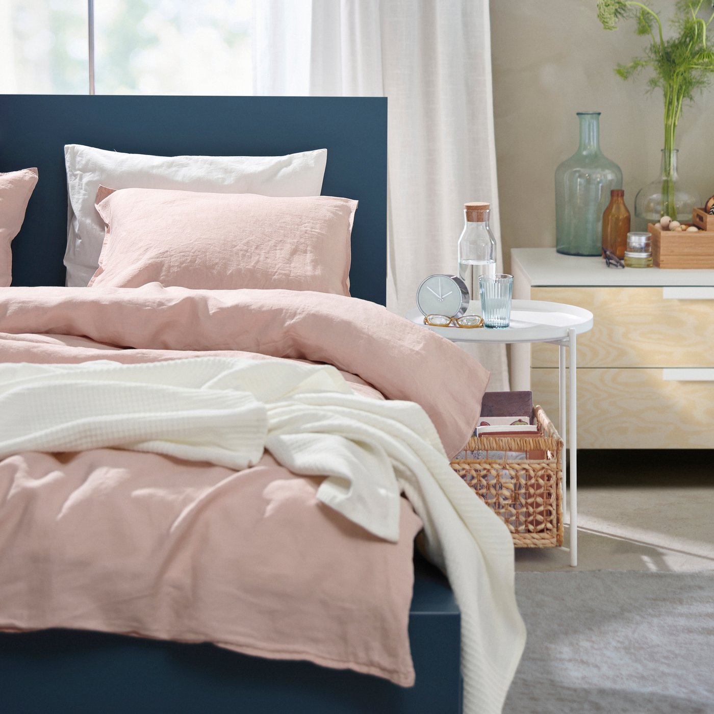 A blue MALM bed frame, high, w 2 storage boxes