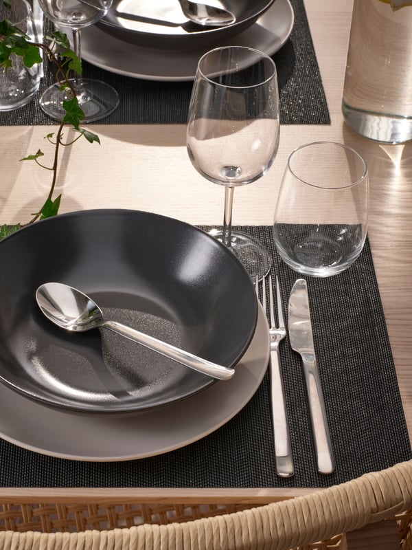 A dark grey FLYGFISK place mat