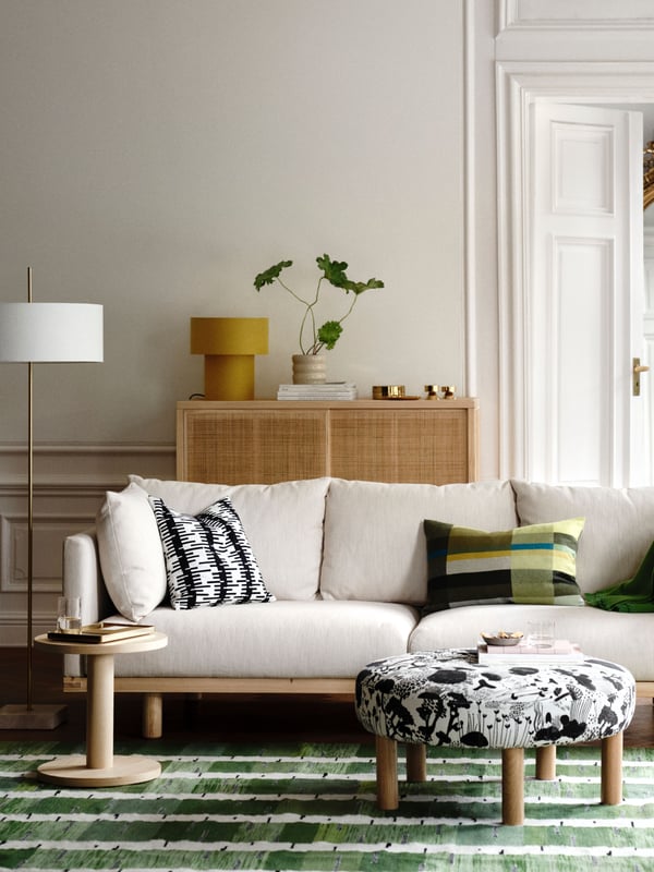 An yellow/textile STOCKHOLM 2025 table lamp in the living room