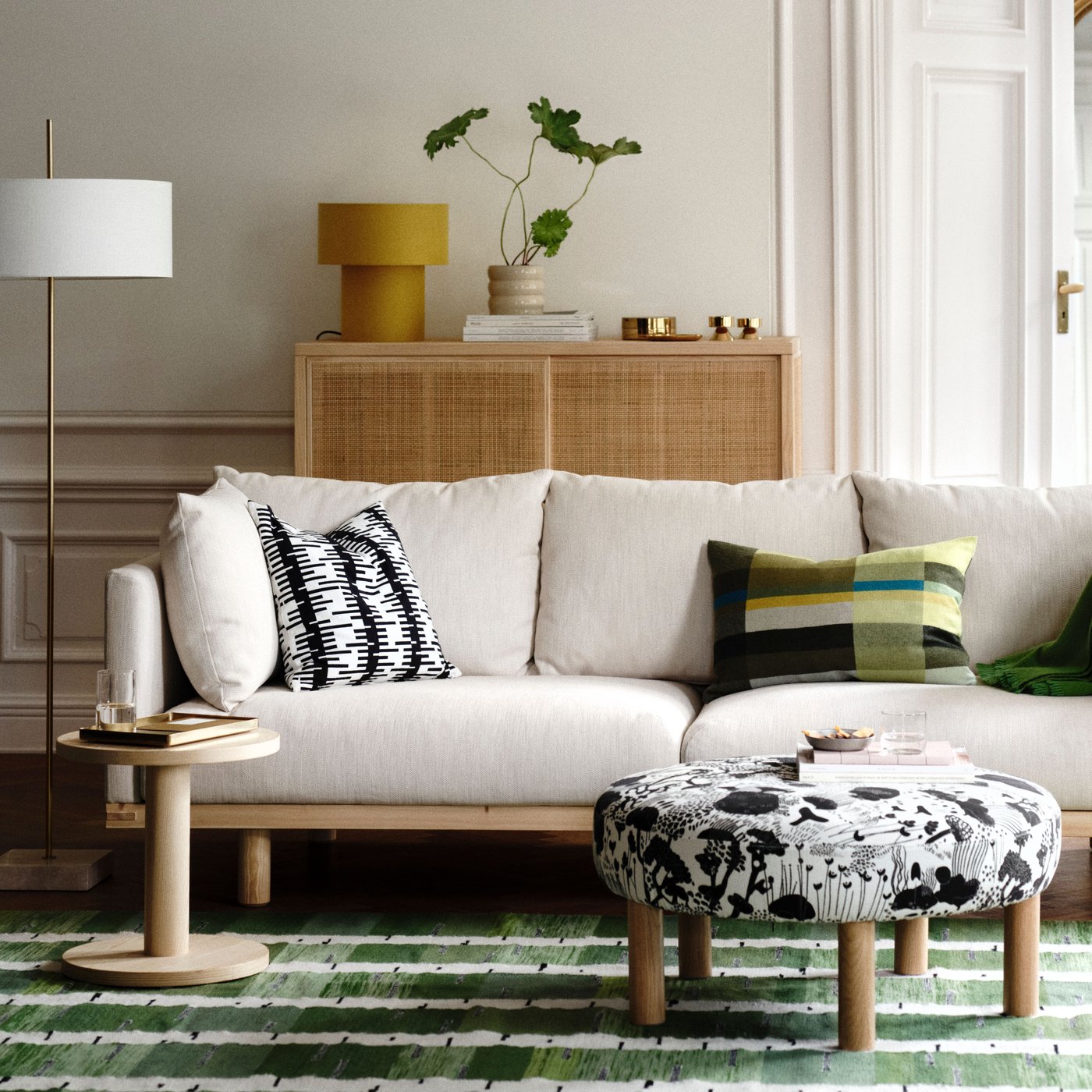 An yellow/textile STOCKHOLM 2025 table lamp in the living room