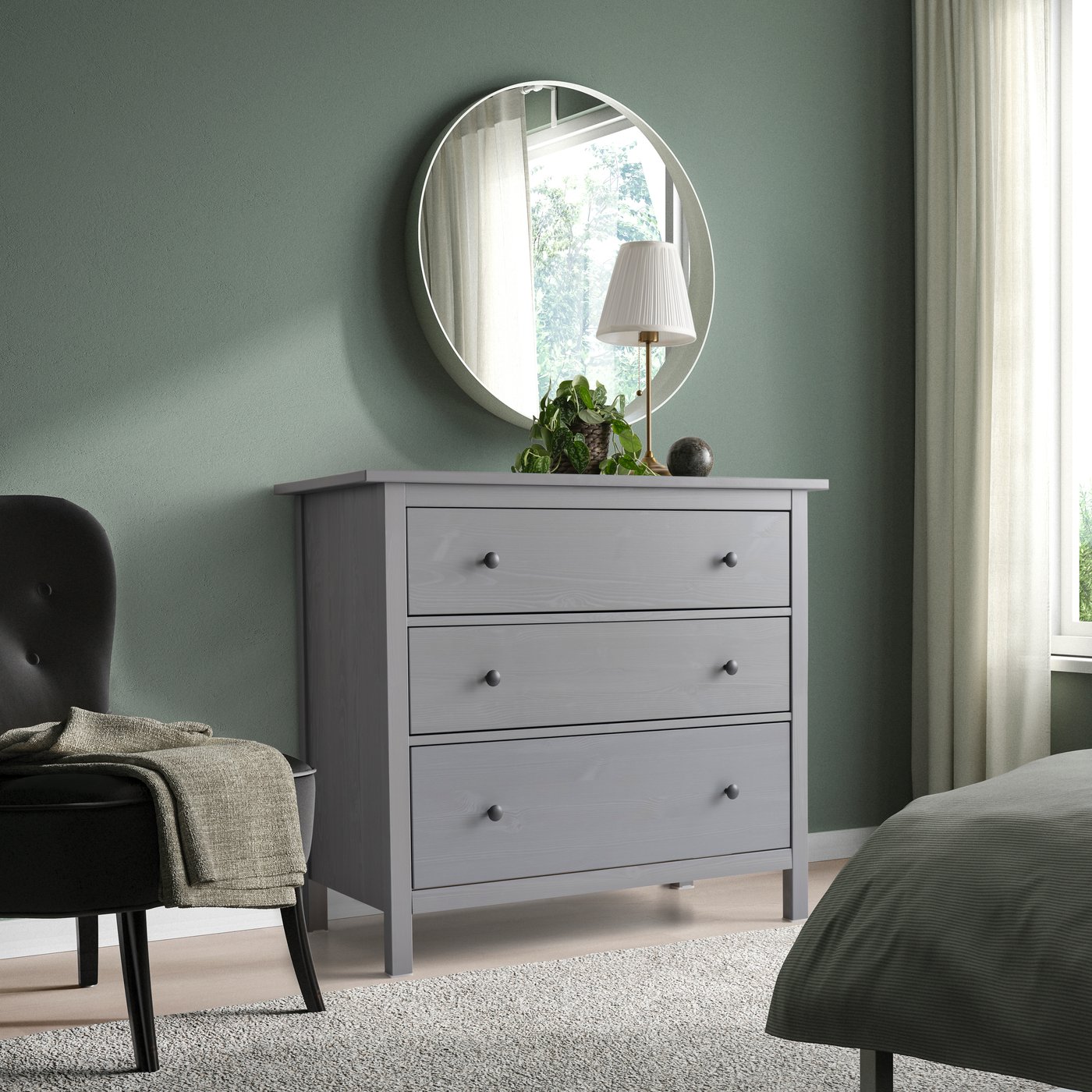 A grey stained HEMNES chest of 3 drawers