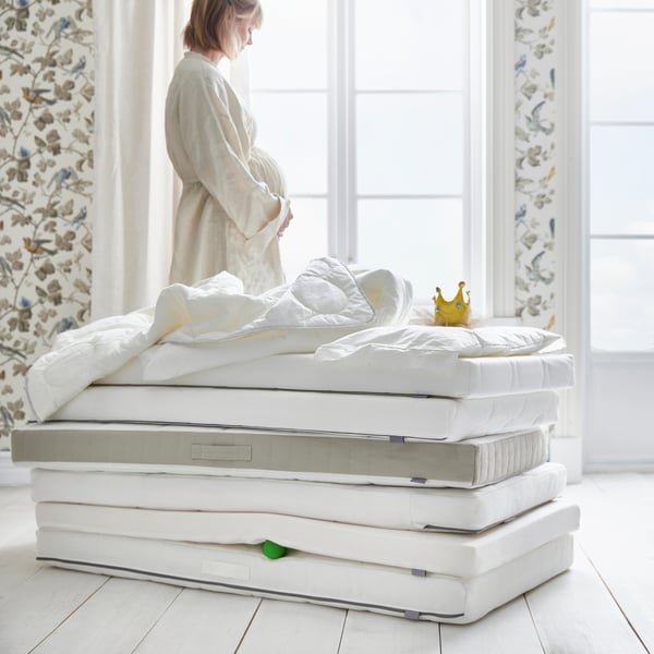 A KRUMMELUR foam mattress for cot in the childrens room