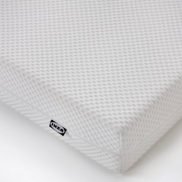 A firm/white ÅBYGDA foam mattress