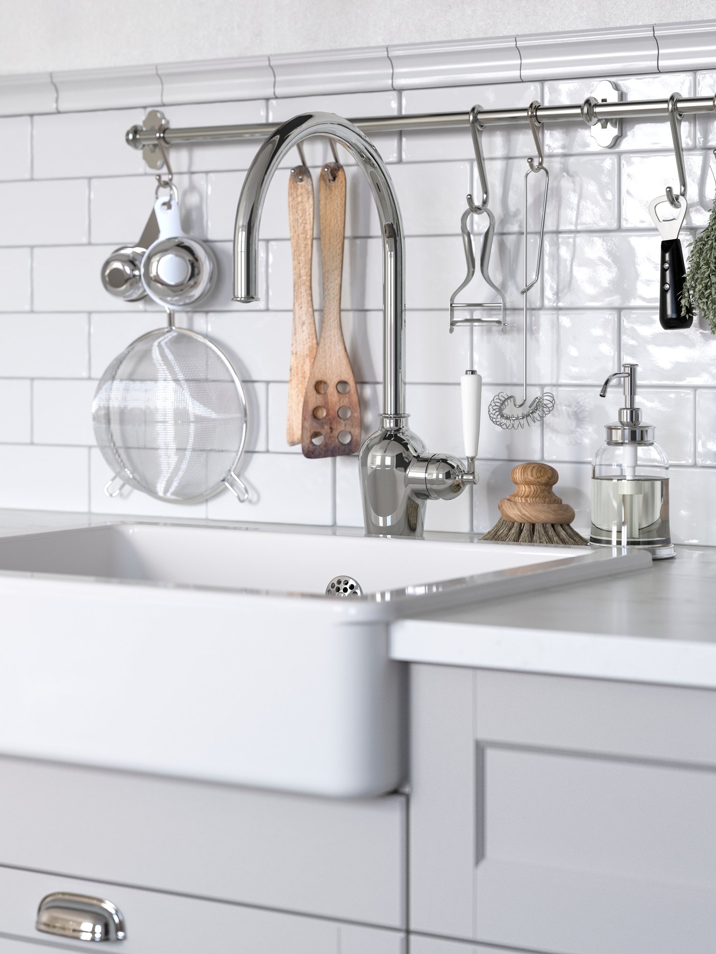 A kitchen with light grey LERHYTTAN fronts and a white sink with a chrome tap.