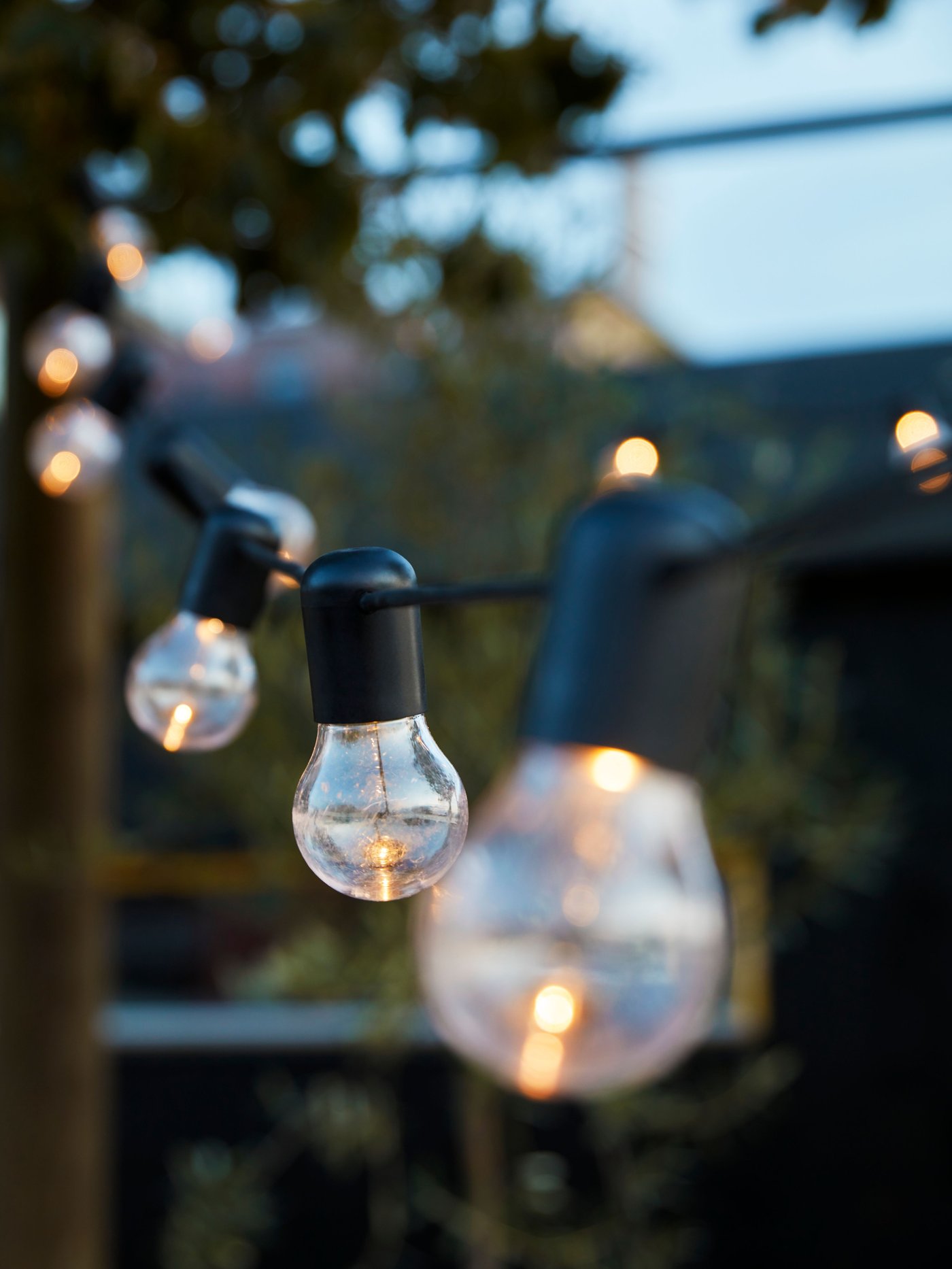 An outdoor/battery-operated black UTSUND LED lighting chain with 12 lights