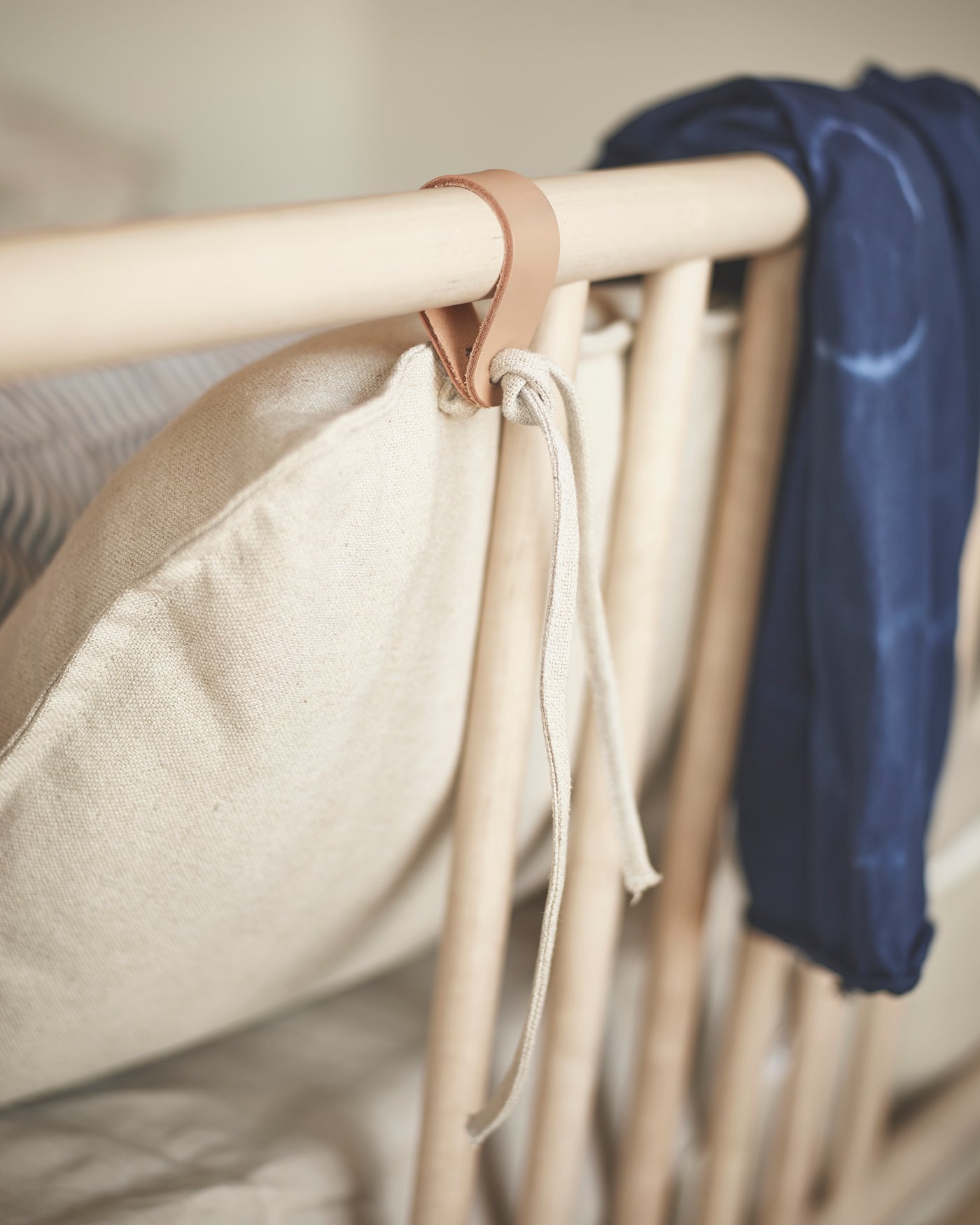 A birch BJÖRKSNÄS bed frame in the living room
